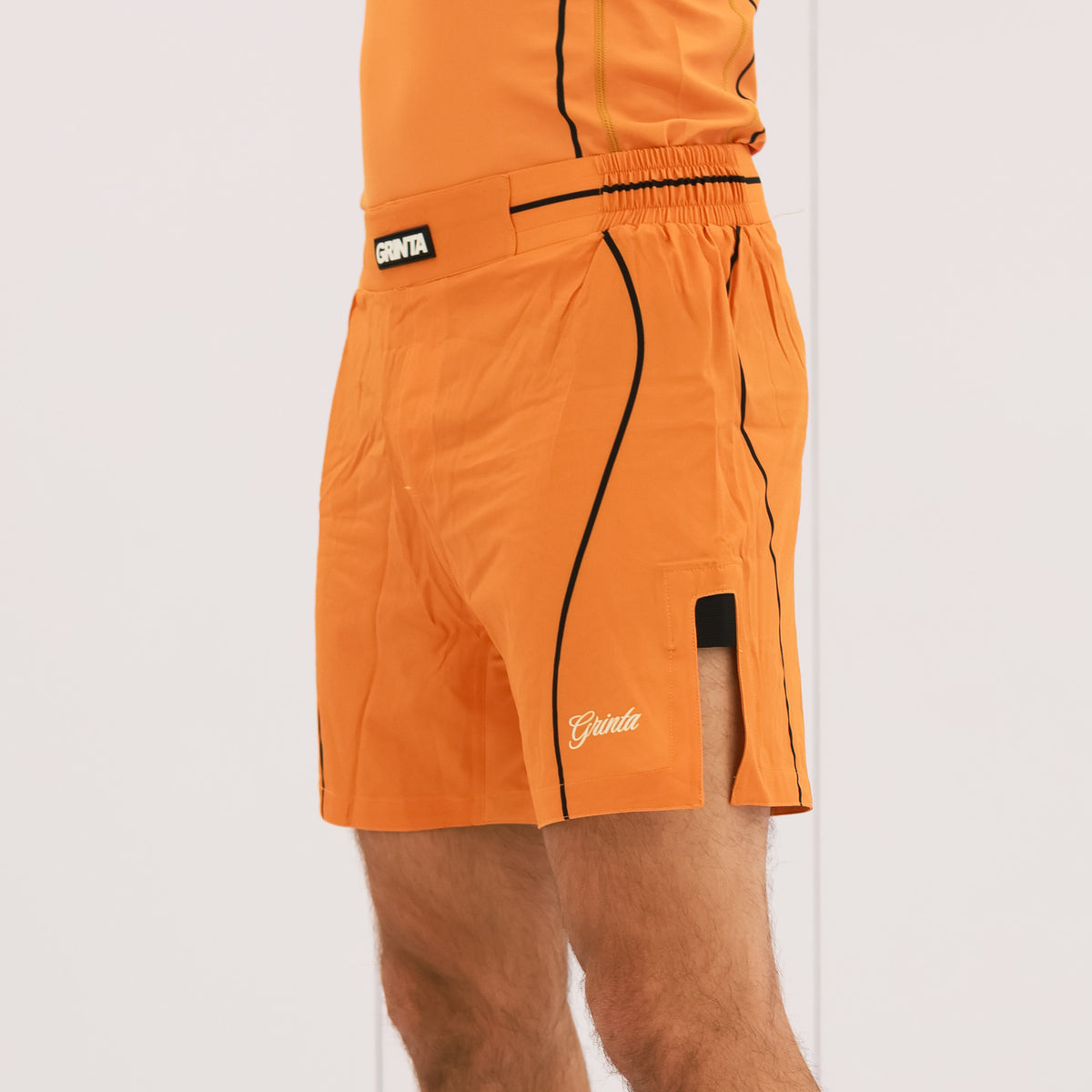 Flow Shorts - Orange/Black